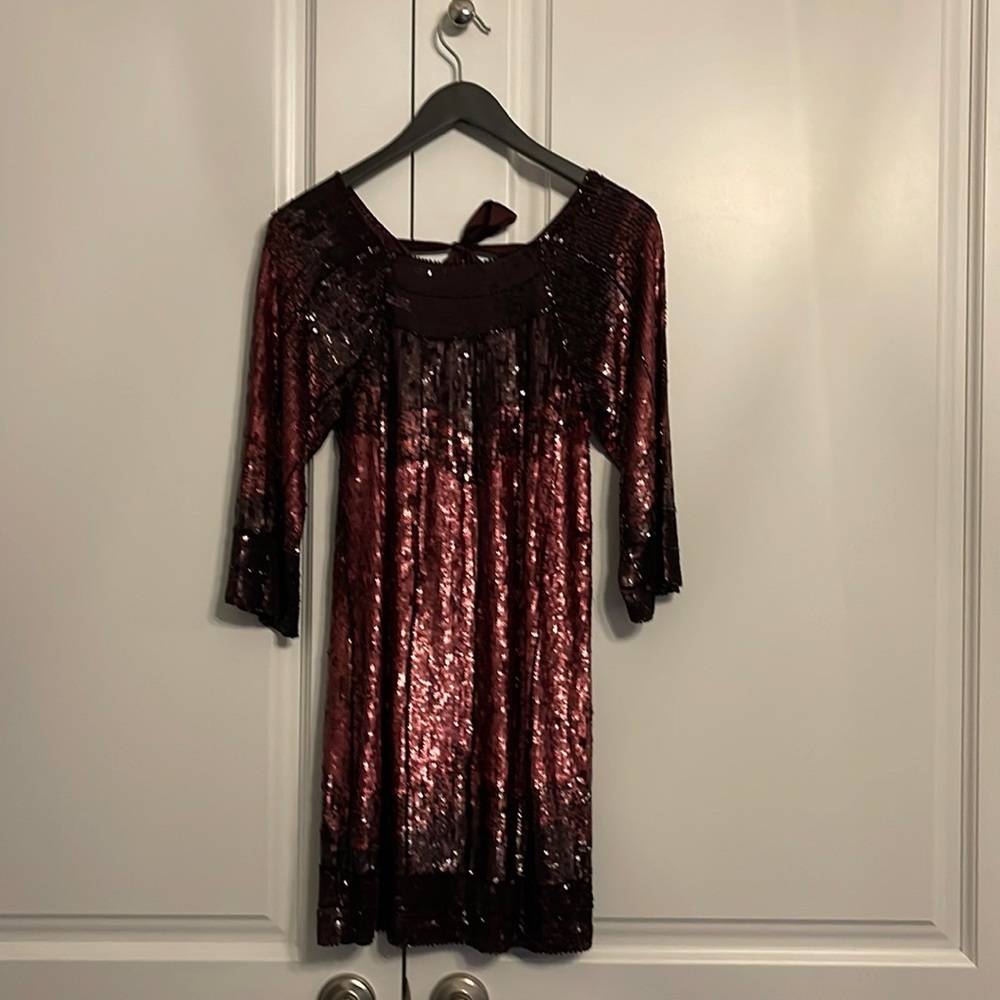 Brand new evening dress with all over sequins. Open back with self tie bow